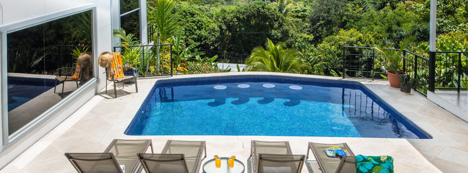 your crystal-clear private pool hangs over the rainforest and enjoys a stunning ocean view.