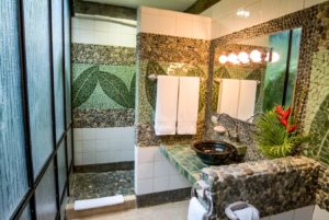 Local artists hand-laid the detailed stone and tile work found in most bathrooms at this vacation home.