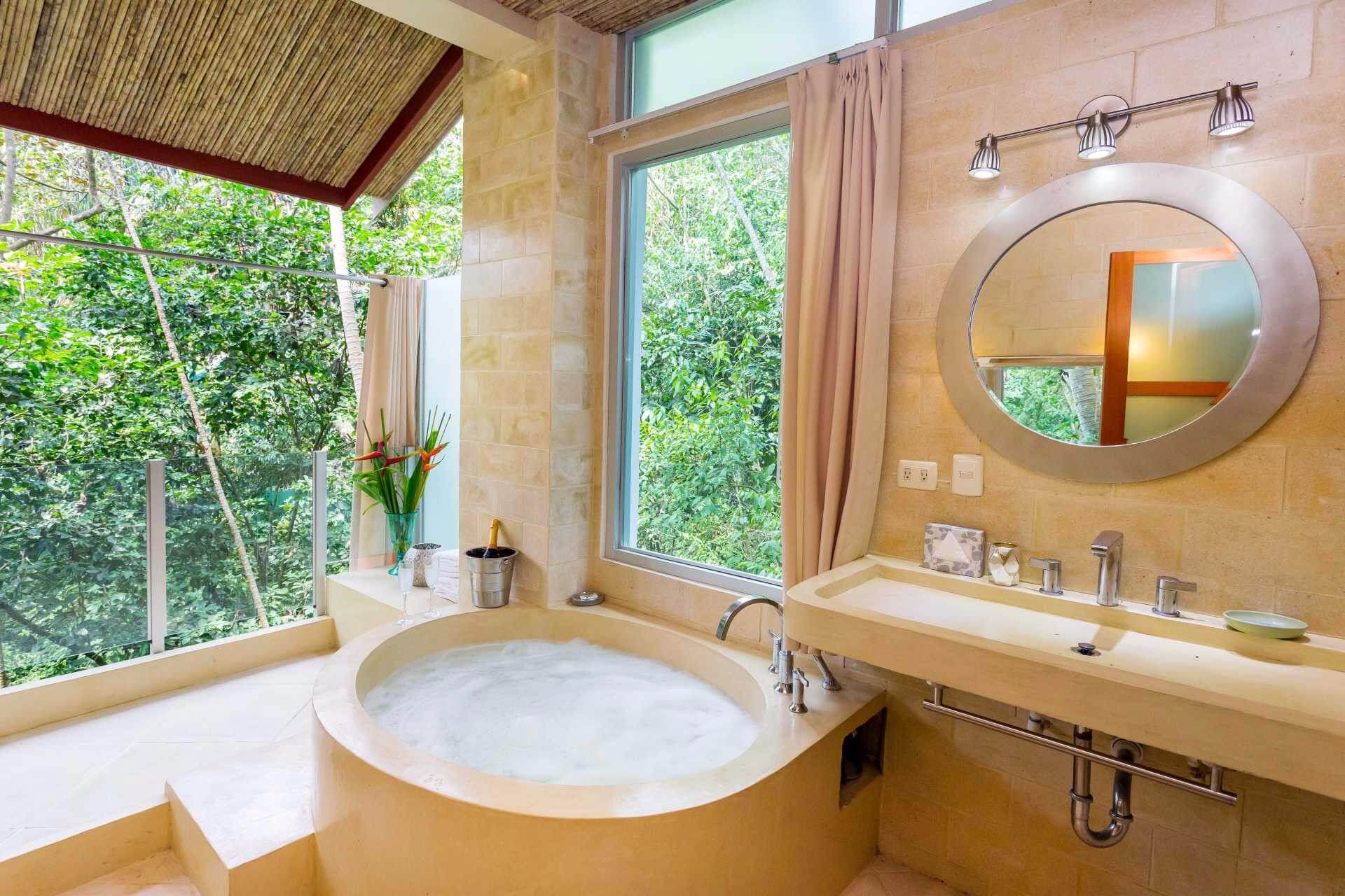 Guest bathroom with stone round tub
