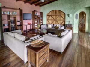 For maximum comfort after a fun day at the beach the villa's living room has 3 sofas and a large-screen TV.