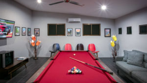 Enjoy relaxing, a game of pool, or watch the large screen TV in the air-conditioned game room on the main level.