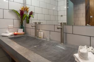The Master Bath has a beautiful built in sink made of concrete.