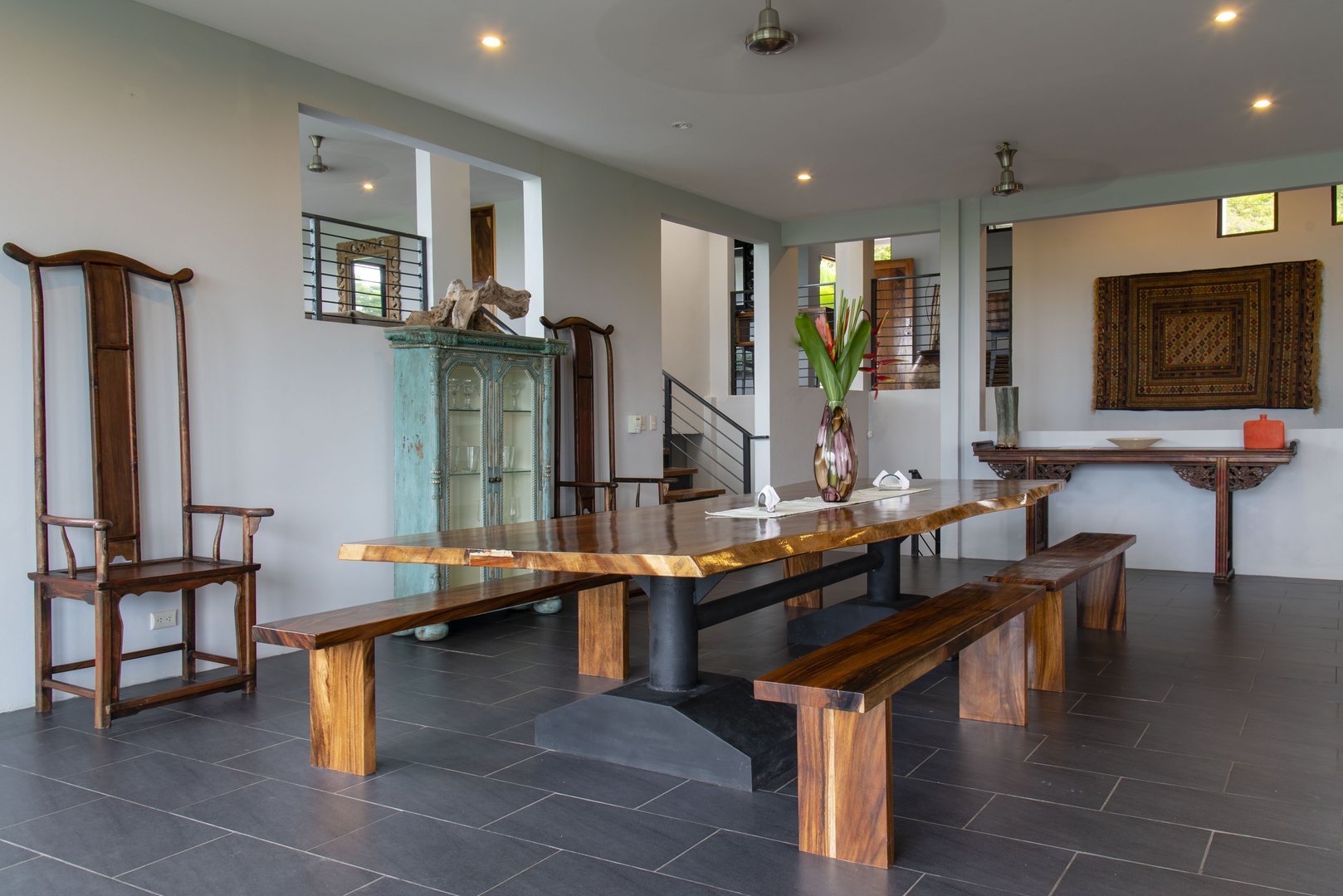 This is no ordinary dining table and the room is complimented with unusual pieces to create a spectacular look at his Manuel Antonio vacation rental.
