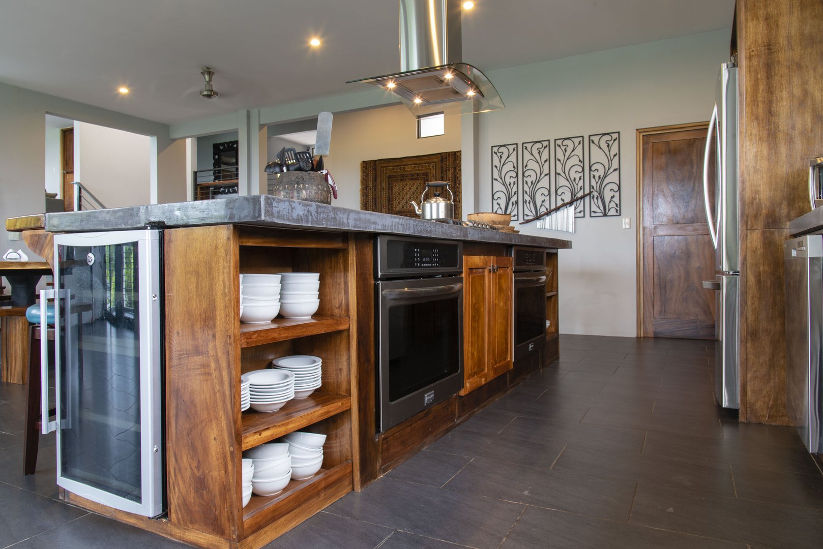 Double ovens, a wine chiller, and custom made counter tops are the luxury appointments to the kitchen at this deluxe rental in Manuel Antonio.