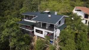 Overhead view of this large 6 bedroom villa nestled in the rainforest with awesome mountain and ocean views.