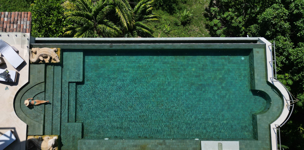 An immense and creatively constructed pool in one of the most privileged spots within the lush forest of Manuel Antonio.