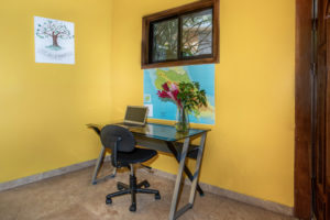 Catch up with friends and family back home using the desk area of the great room.
